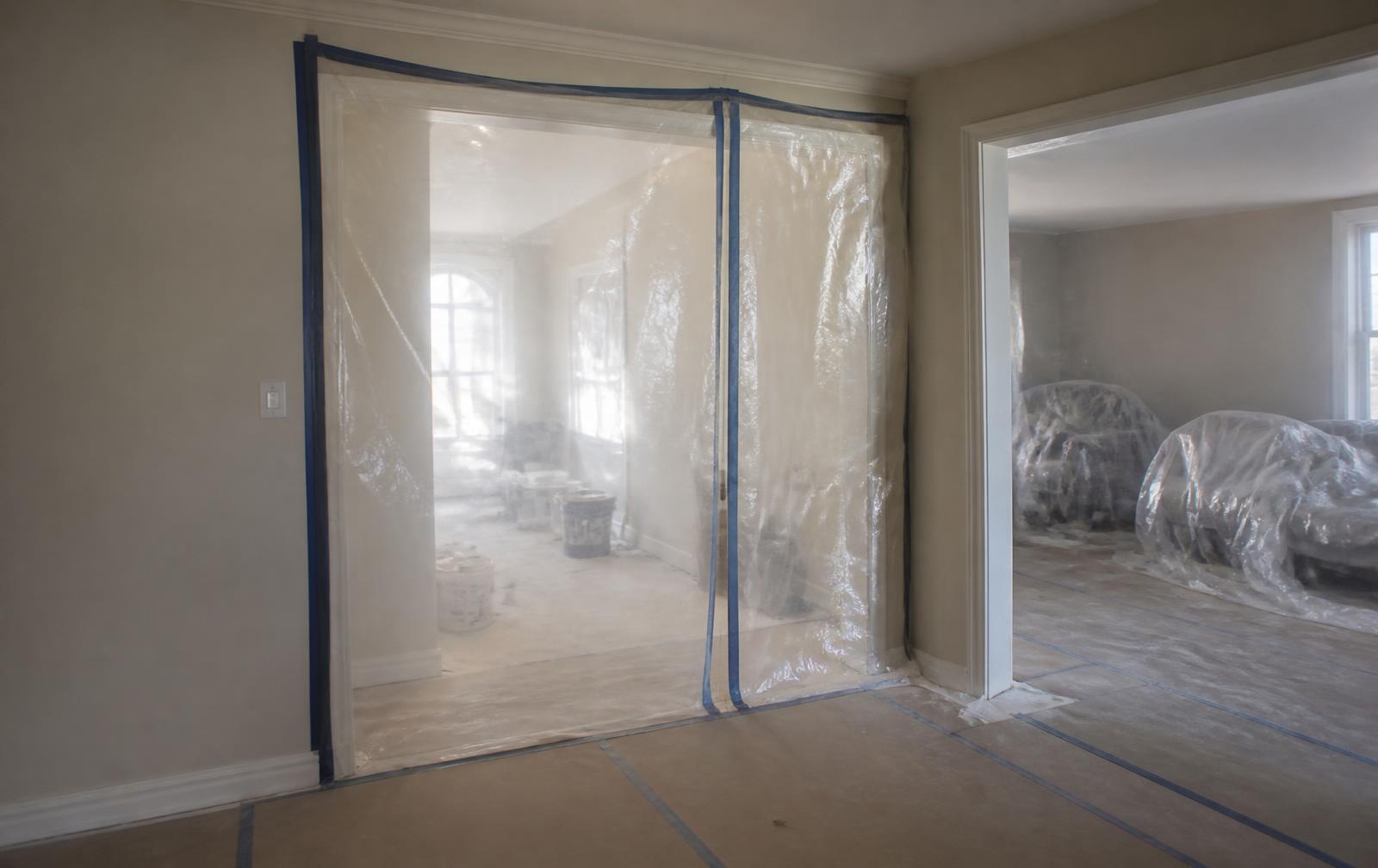 Temporary plastic barrier and floor protection installed inside a property